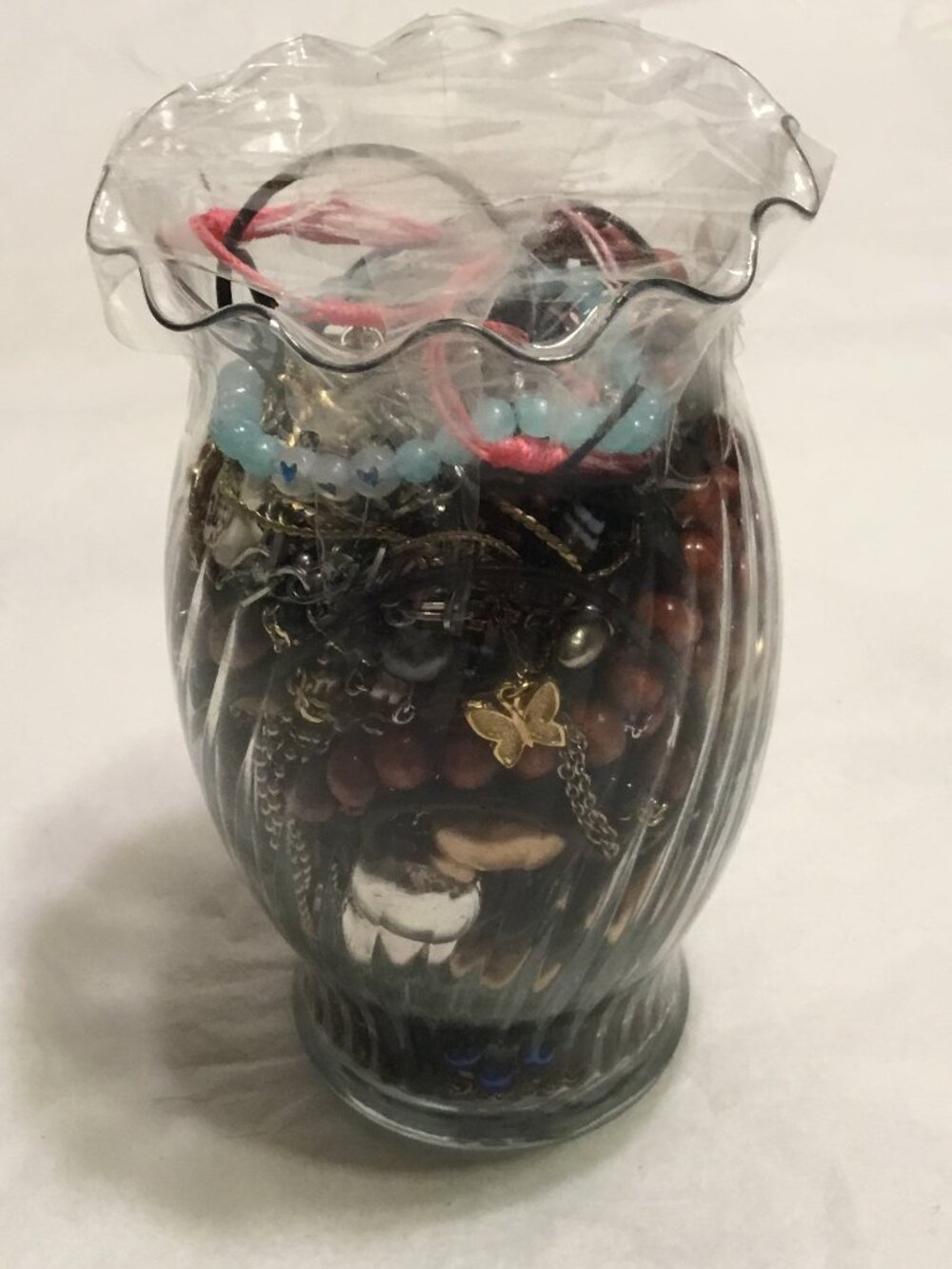 Vase filled with good wearable or resaleable jewelry - necklaces, etc.